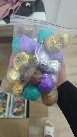 Assorted wrapped chocolate candies in a bag